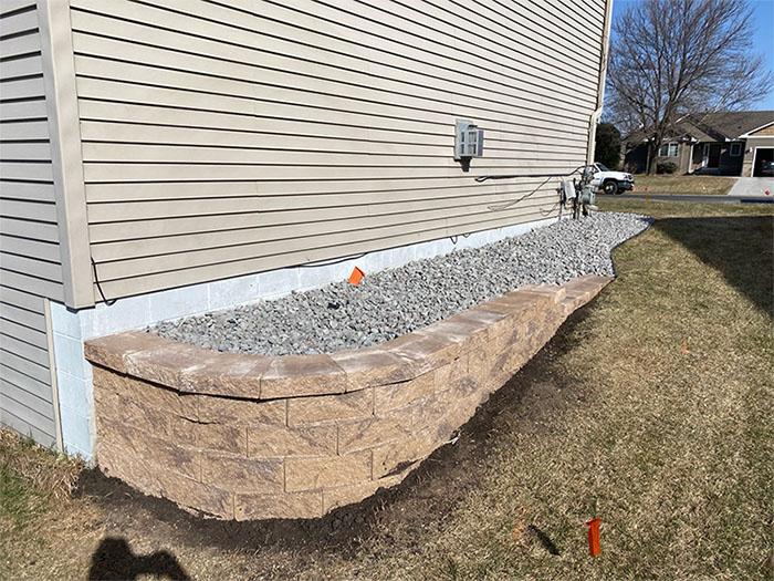 Rock bed on side of the house